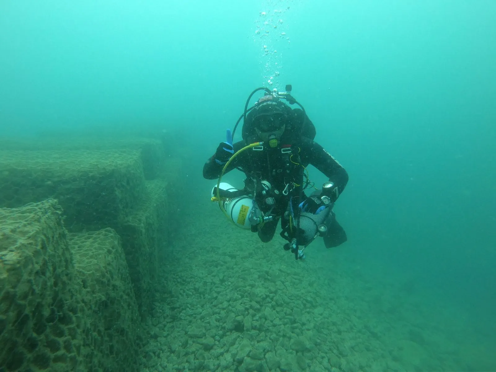 Aquatic commercial diver working beneath the surface